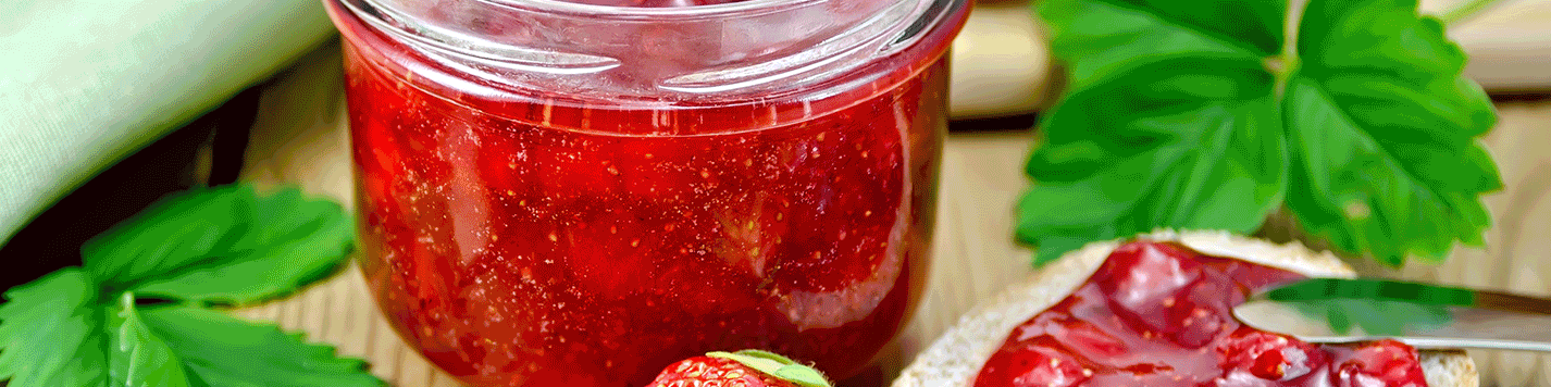 Close-up of a jar of vibrant strawberry jam